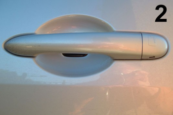Pic 2 The emergency access handle is usually located on the passengers side of the car, Identified by the key logo on the handle